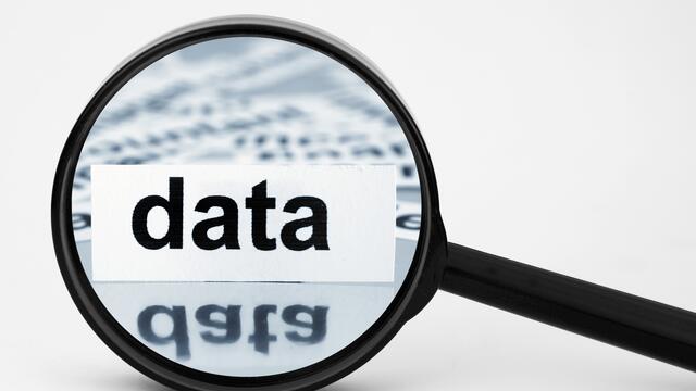 A magnifying glass over "data".