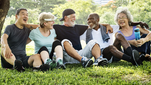 Group of friends exercise outdoors