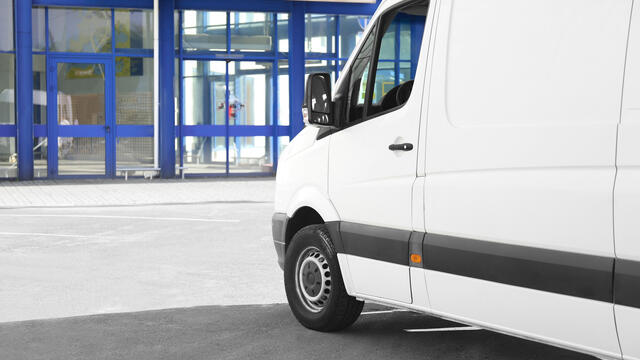 White panel van parked on the street
