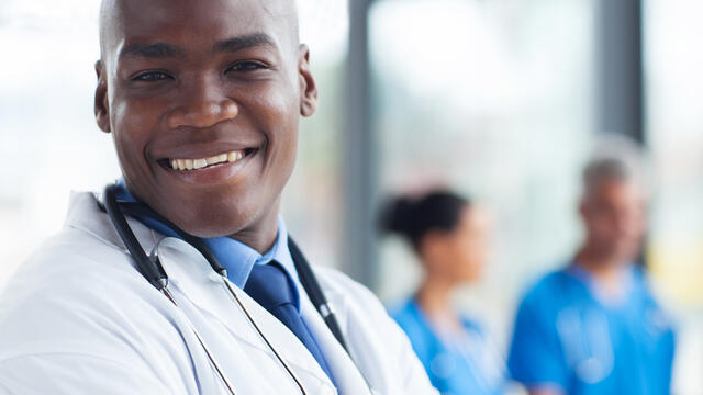 A smiling doctor.