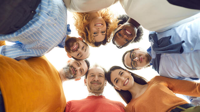 A group of adults gathered in a circle