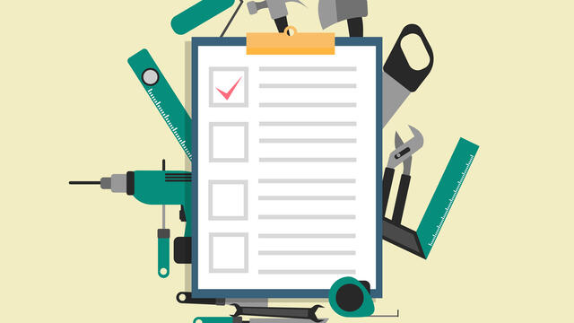 Checklist on a clipboard surrounded by tools
