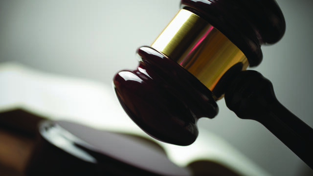 Close up view of a gavel ready to hit sound board
