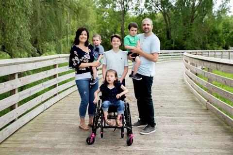 Family on a wooden path
