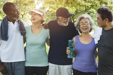 Five adults, post exercise, with water and towels