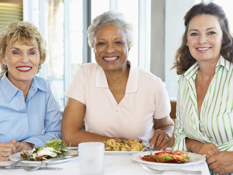 Three adults having lunch together.