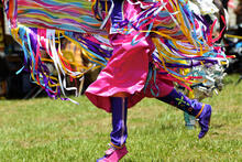 Native American dancing in traditional clothing