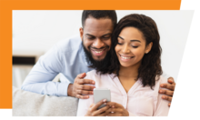 Two people looking at a smart phone