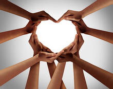 Multiple hands creating a heart shape