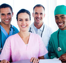 Four different healthcare professionals smiling