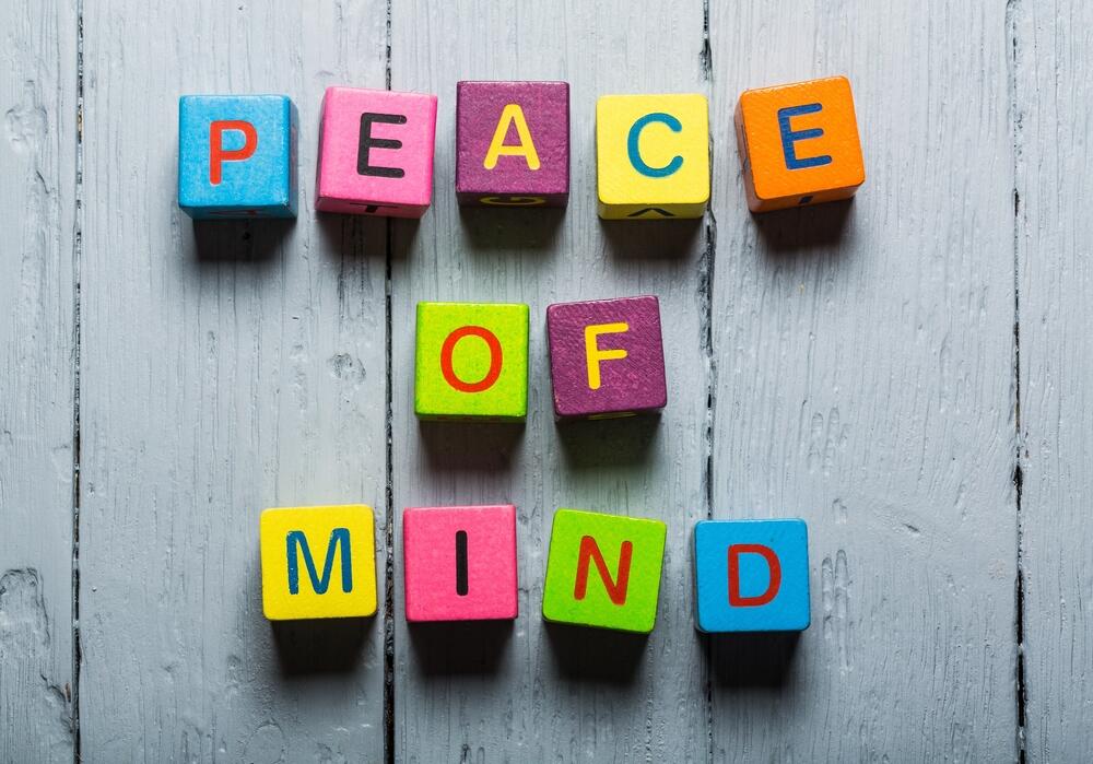 Colored blocks spelling Peace of Mind